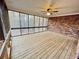 Sunroom features a ceiling fan, screened windows, and wood deck at 342 Mccurry Rd, Stockbridge, GA 30281