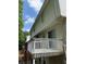 Back deck with white banisters and the green trees in the background at 5047 Chupp Way Cir, Lithonia, GA 30038