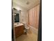 Bright bathroom with a single vanity and shower/tub combination at 5047 Chupp Way Cir, Lithonia, GA 30038
