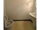 Clean half bathroom featuring a toilet, sink, and modern fixtures for convenience at 5047 Chupp Way Cir, Lithonia, GA 30038