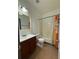 Bathroom with a shower/tub combo and a single vanity at 5047 Chupp Way Cir, Lithonia, GA 30038