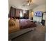 Bedroom with unique furnishings and decor, illuminated by natural light through the curtains at 5047 Chupp Way Cir, Lithonia, GA 30038