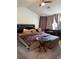 Bedroom with unique furnishings and decor, illuminated by natural light through the curtains at 5047 Chupp Way Cir, Lithonia, GA 30038