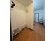 Walk-in closet with wood floor, wire shelves, and hanging racks for optimal storage organization at 5047 Chupp Way Cir, Lithonia, GA 30038