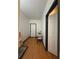 Hallway featuring a chair, a door, and light hardwood floors at 5047 Chupp Way Cir, Lithonia, GA 30038