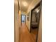 Hallway with hardwood floors and two bedrooms at 5047 Chupp Way Cir, Lithonia, GA 30038