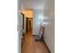Hallway featuring a chair, artwork, and light hardwood floors at 5047 Chupp Way Cir, Lithonia, GA 30038