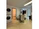 Kitchen/laundry area has a washer/dryer combo, table and chairs with access to other rooms at 5047 Chupp Way Cir, Lithonia, GA 30038