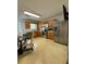 Well-lit kitchen with stainless steel appliances, wood cabinets, and a table setting for dining at 5047 Chupp Way Cir, Lithonia, GA 30038