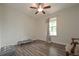 Bright bedroom with wood floors, a window, and a ceiling fan at 92 Confidence Ct, Temple, GA 30179