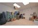 Carpeted bonus room with a light fixture, a hutch, and musical instruments at 92 Confidence Ct, Temple, GA 30179