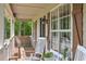Relaxing covered front porch with seating and decorative accents at 92 Confidence Ct, Temple, GA 30179