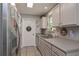 Well-lit kitchen featuring stainless steel appliances and ample cabinet space, offering a functional and stylish cooking environment at 92 Confidence Ct, Temple, GA 30179