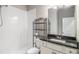 Bathroom showcasing a stand-up shower, toilet, and modern vanity with dark countertop at 101 Ruby Lane, Mcdonough, GA 30252