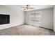 Bright bedroom featuring plush carpets, and a large window at 101 Ruby Lane, Mcdonough, GA 30252