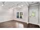Dining Room featuring tray ceilings, hardwood floors and wainscoting at 101 Ruby Lane, Mcdonough, GA 30252