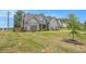 Beautiful two-story home with light blue siding, manicured lawn and shrubbery at 101 Ruby Lane, Mcdonough, GA 30252