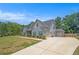 Charming two-story home with light blue siding, grey accents and a large paved driveway at 101 Ruby Lane, Mcdonough, GA 30252