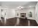 Spacious living room with hardwood floors, a stone fireplace, and lots of natural light at 101 Ruby Lane, Mcdonough, GA 30252