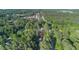 Aerial view of house with surrounding trees and neighborhood at 1129 Pinehurst Rd, Grayson, GA 30017