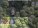 Aerial view of property with wooded areas and estimates on property lines at 1129 Pinehurst Rd, Grayson, GA 30017