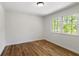 Bedroom with wood-look flooring and window at 1129 Pinehurst Rd, Grayson, GA 30017