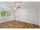 Bright bedroom with hardwood floors and large windows at 1129 Pinehurst Rd, Grayson, GA 30017