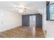 Open living room with hardwood floors and paneled accent wall at 1129 Pinehurst Rd, Grayson, GA 30017