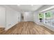 A bright, open-concept living area with beautiful hardwood floors and large bay window at 1129 Pinehurst Rd, Grayson, GA 30017