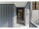 Exterior image of the side entry door with traditional hardware and glass windows at 1129 Pinehurst Rd, Grayson, GA 30017