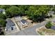 Aerial view of a quaint home with a detached garage and new fence in a well-established neighborhood at 130 South Se Ave, Marietta, GA 30060