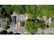 Aerial view of a property with a house, garage, and trees within defined red boundaries at 130 South Se Ave, Marietta, GA 30060