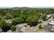 Birds eye view of a home with a detached garage and new fence in a tree-lined neighborhood at 130 South Se Ave, Marietta, GA 30060