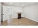 Bright room featuring wood-look floors and a fireplace at 130 South Se Ave, Marietta, GA 30060