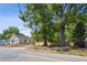 Inviting single-story home with a manicured lawn, mature trees, and a newly constructed privacy fence at 130 South Se Ave, Marietta, GA 30060