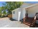 Charming exterior featuring wooden steps and a gravel area, set against lush trees at 130 South Se Ave, Marietta, GA 30060