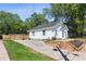 Charming white home with a well-maintained lawn, quaint front yard landscaping, and a newly built fence at 130 South Se Ave, Marietta, GA 30060