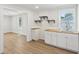 Kitchenette with white cabinets, wood countertops, and open shelving at 130 South Se Ave, Marietta, GA 30060