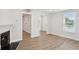 Inviting living area featuring wood-look floors and a charming fireplace at 130 South Se Ave, Marietta, GA 30060