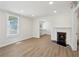 Comfortable living room with wood-look floors and a charming fireplace at 130 South Se Ave, Marietta, GA 30060