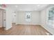 Bright living room featuring wood-look floors and a large window at 130 South Se Ave, Marietta, GA 30060