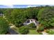 Aerial view of stunning home surrounded by lush greenery and mature trees in a desirable location at 1358 Peppergrass Nw Trl, Acworth, GA 30101