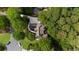 Aerial view of property reveals beautiful landscaping, circular drive, and mature trees at 1358 Peppergrass Nw Trl, Acworth, GA 30101