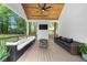 Spacious covered patio with outdoor seating, a fire pit, and backyard views at 1358 Peppergrass Nw Trl, Acworth, GA 30101