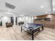 Finished basement features a ping pong table, fireplace, and living area at 1358 Peppergrass Nw Trl, Acworth, GA 30101