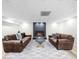 Cozy basement area showcases a stone fireplace and comfortable leather sofas at 1358 Peppergrass Nw Trl, Acworth, GA 30101