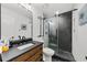 Modern bathroom features sliding glass shower doors and a stylish vanity at 1358 Peppergrass Nw Trl, Acworth, GA 30101