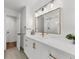 Modern bathroom with marble countertop, double sink and stylish lighting at 1358 Peppergrass Nw Trl, Acworth, GA 30101