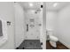 This bathroom features a modern shower, updated toilet, and sleek tiling at 1358 Peppergrass Nw Trl, Acworth, GA 30101