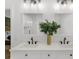 Bright bathroom with double vanity, quartz countertops, modern fixtures and decorative mirrors at 1358 Peppergrass Nw Trl, Acworth, GA 30101